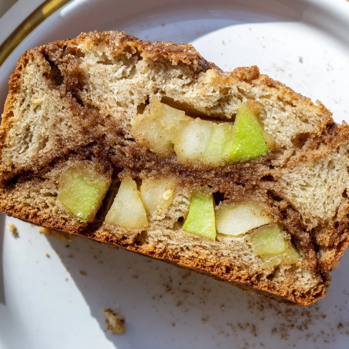 Homemade cinnamon apple bread with marbled cinnamon sugar swirl and tender moist texture