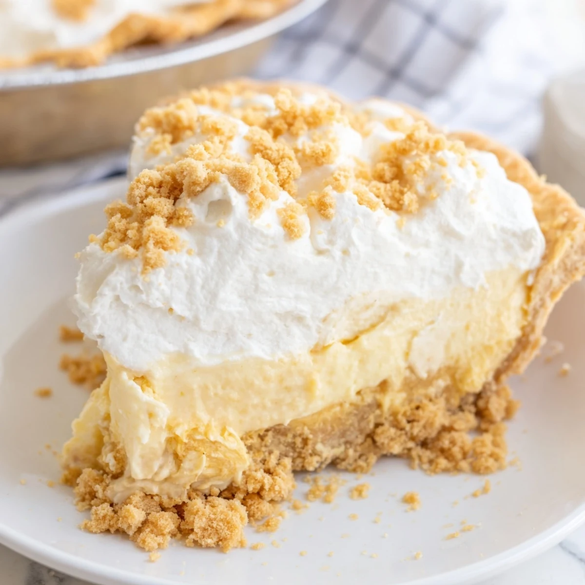 Slice of old fashioned Amish peanut butter dream pie showing velvety custard filling