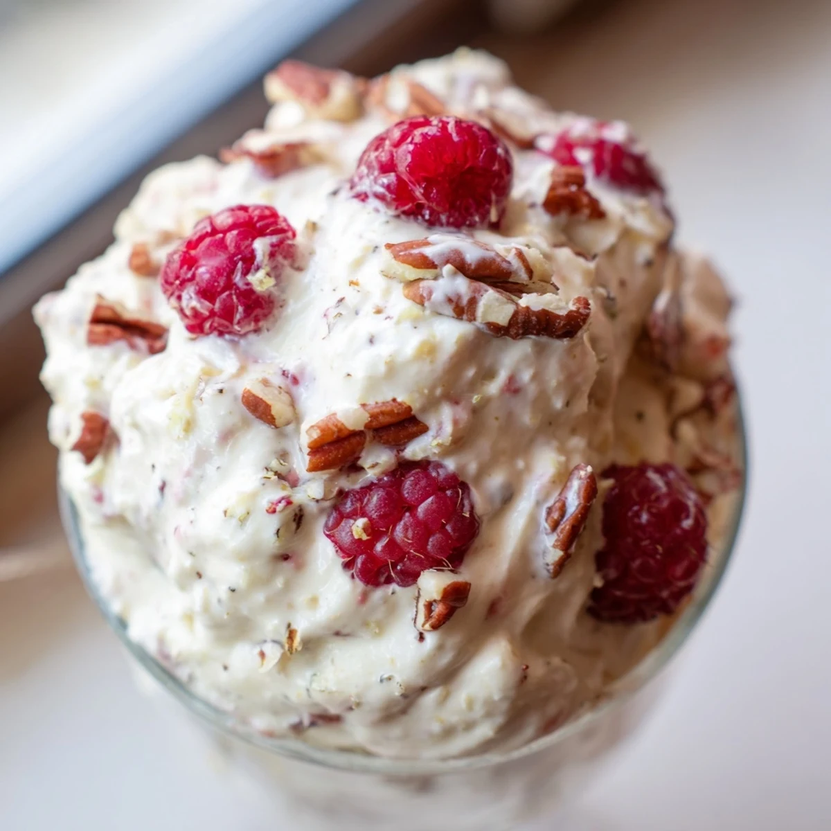 Light and airy keto cheesecake fluff swirled high in serving dishes