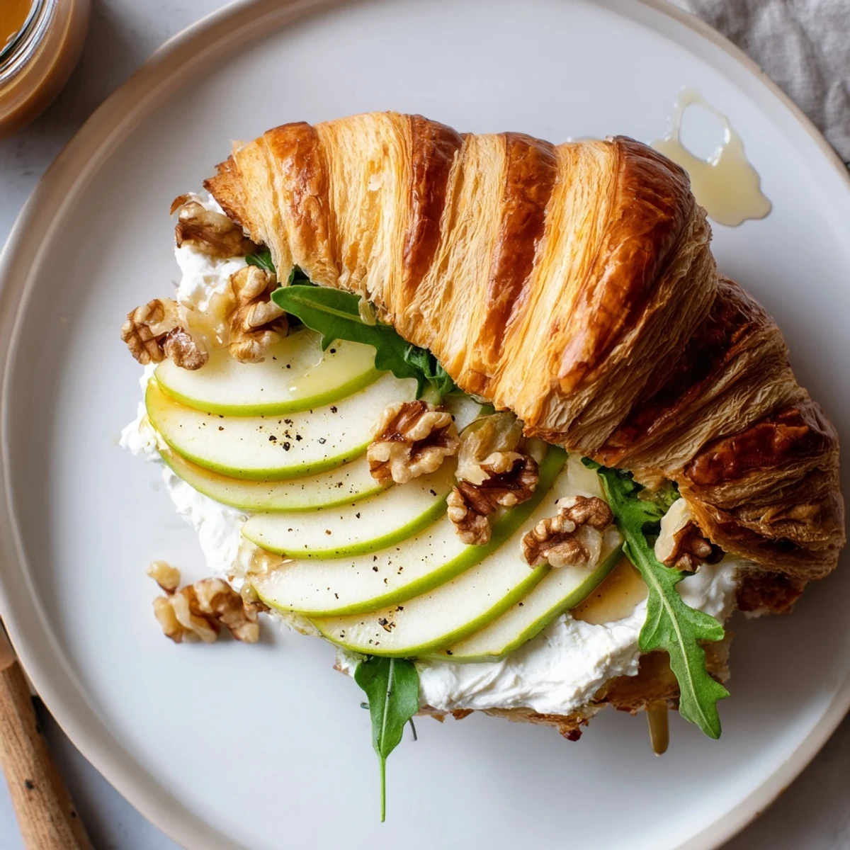 Apple Goat Cheese Croissant Sandwich with lightly toasted croissant, creamy goat cheese, crisp apples.