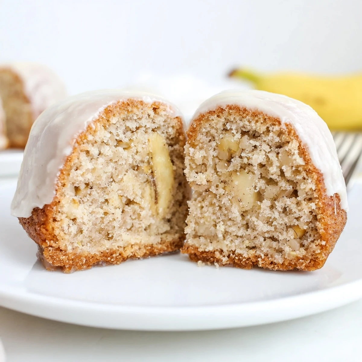 Banana Donuts glistening with vanilla glaze, warm from the oven