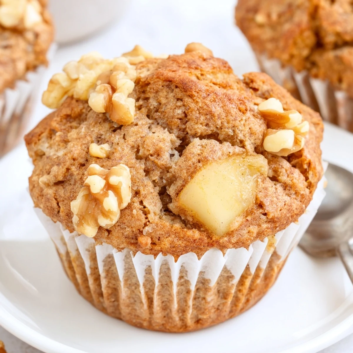 Healthy Apple Cinnamon Greek Yogurt Muffins steaming in a paper lined tin