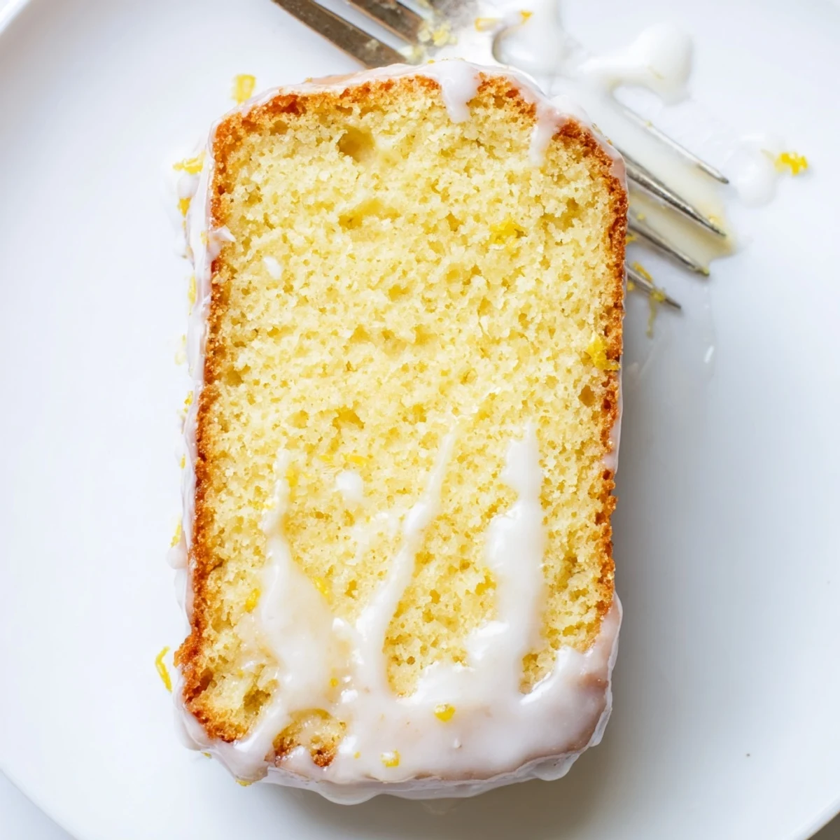 Fresh lemon loaf with yogurt baked to golden perfection and sweet glaze dripping down