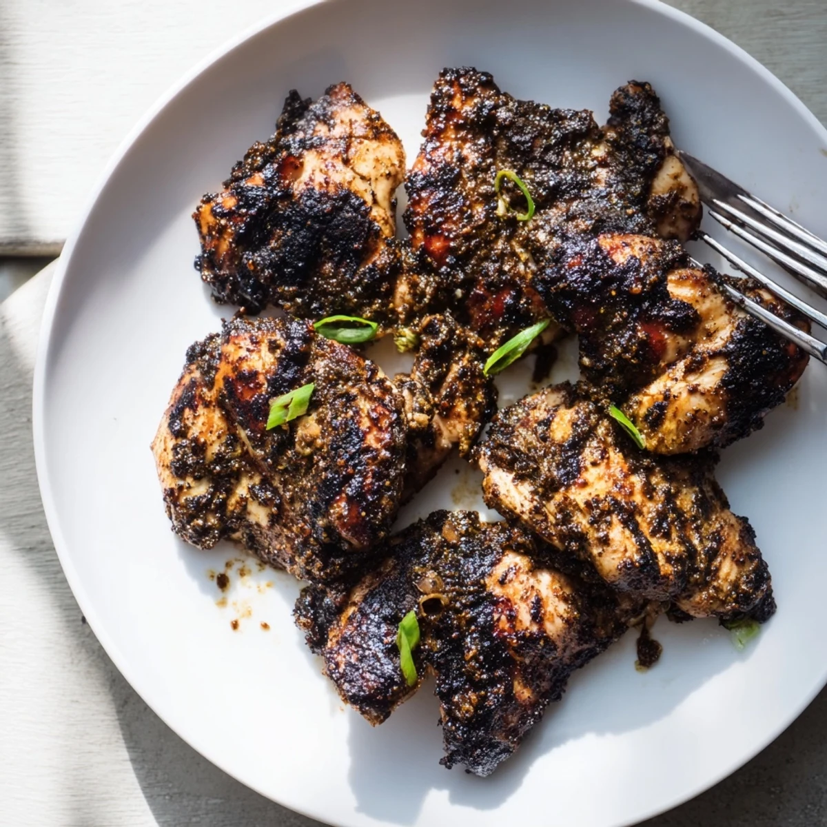 Plate of authentic Jamaican Jerk Chicken served with rice and peas for a Caribbean feast