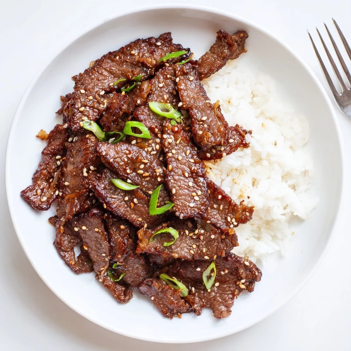 Thinly sliced Korean Beef tossed with green onions and toasted sesame seeds