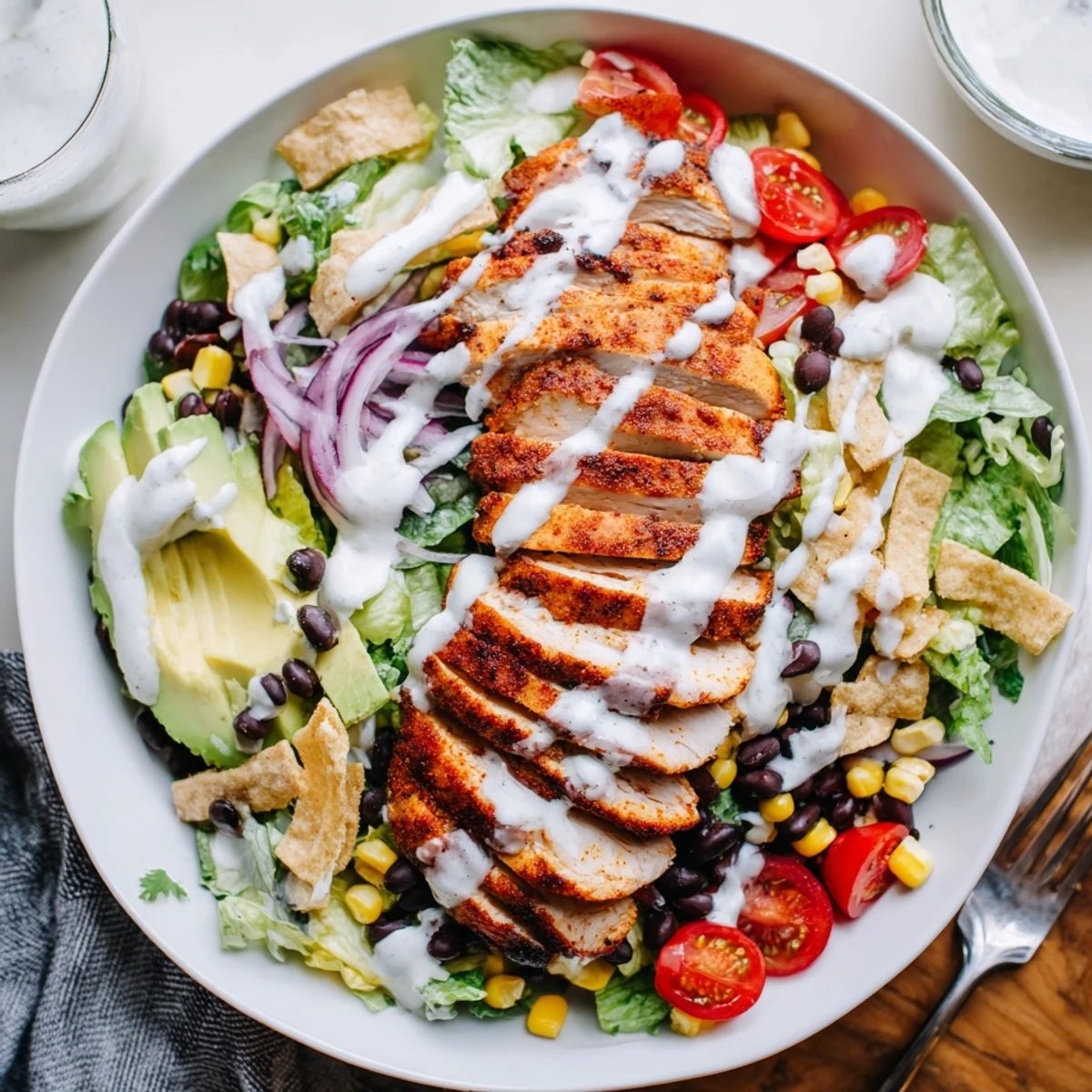 Spicy Southwest Salad With Spicy Ranch Dressing bright corn, black beans, crunchy tortilla strips