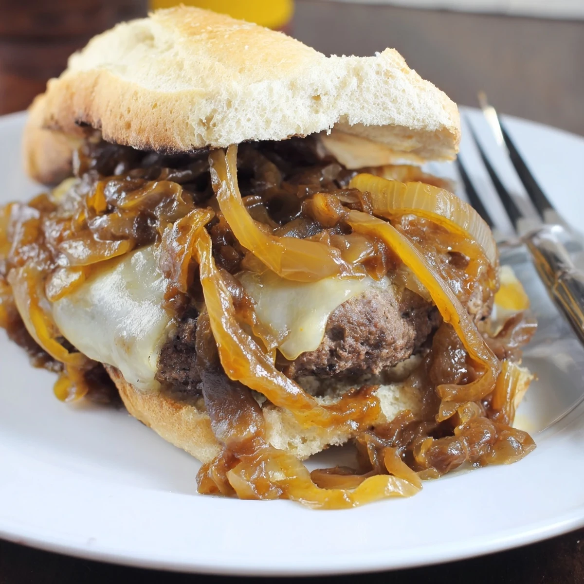 Crispy toasted hoagie buns piled high with smothered hamburger steak and savory onion gravy