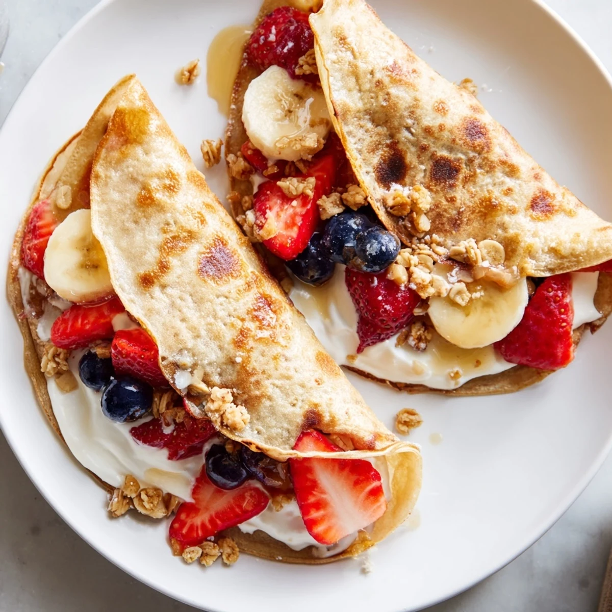 Golden pancake tacos folded around scrambled eggs and crispy crumbled bacon